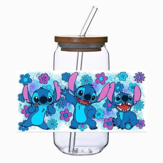 Glass tumbler with a straw and blue alien cartoon character on a white background
