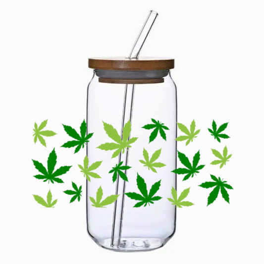 Clear tumbler with the 420 leafs two greens cup wrap, bamboo lid, and straw on a white background.
