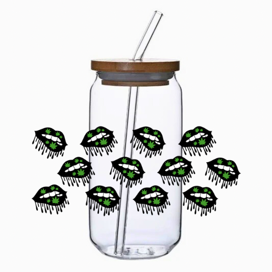 Clear glass tumbler with bamboo lid and straw, featuring multiple black and green lip designs.