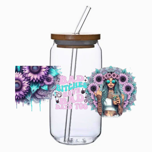 Glass tumbler with bamboo lid and straw, featuring a design of a woman with flowers and text on a white background.
