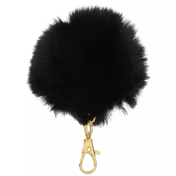 Black fluffy pom-pom keychain with a gold clasp on a white background