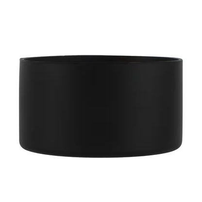 Black tumbler boot on a white background