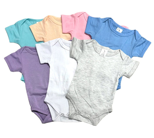 Set of colorful baby bodysuits on a white background