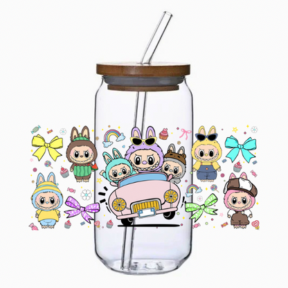 Clear tumbler with cartoon characters and colorful designs on a white background