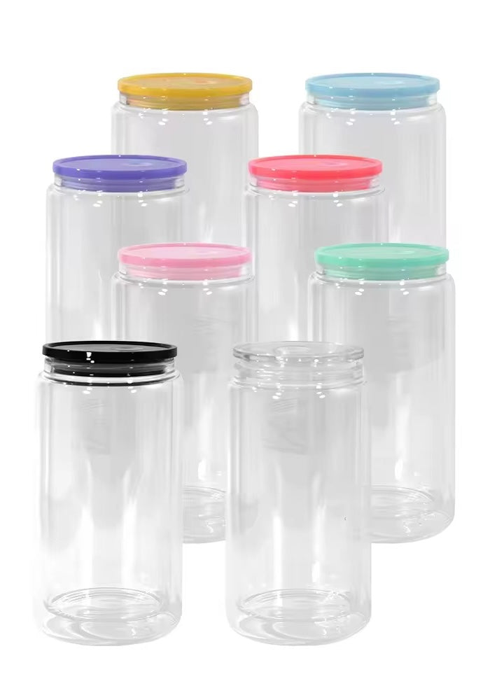 Clear plastic tumblers with colorful lids on a white background