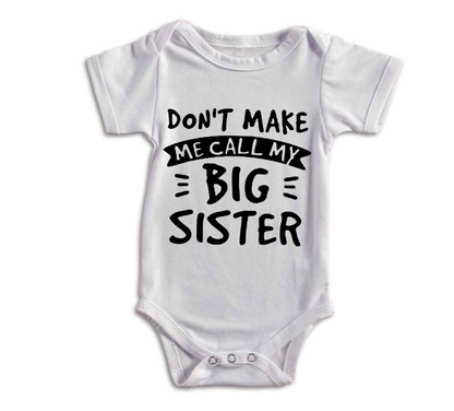 White baby onesie with text 'Don't make me call my big sister' on a white background