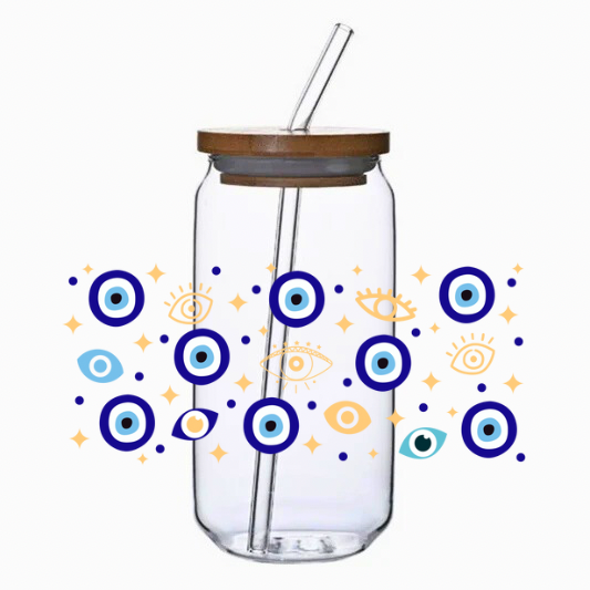 Clear glass tumbler with bamboo lid and straw, featuring blue eye pattern on a white background