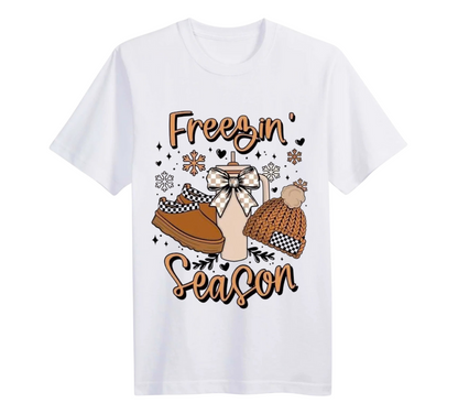 White t-shirt with winter-themed graphic and 'Freezin Season' text on a white background