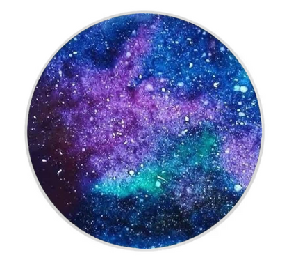 Round coaster with a galaxy design on a white background