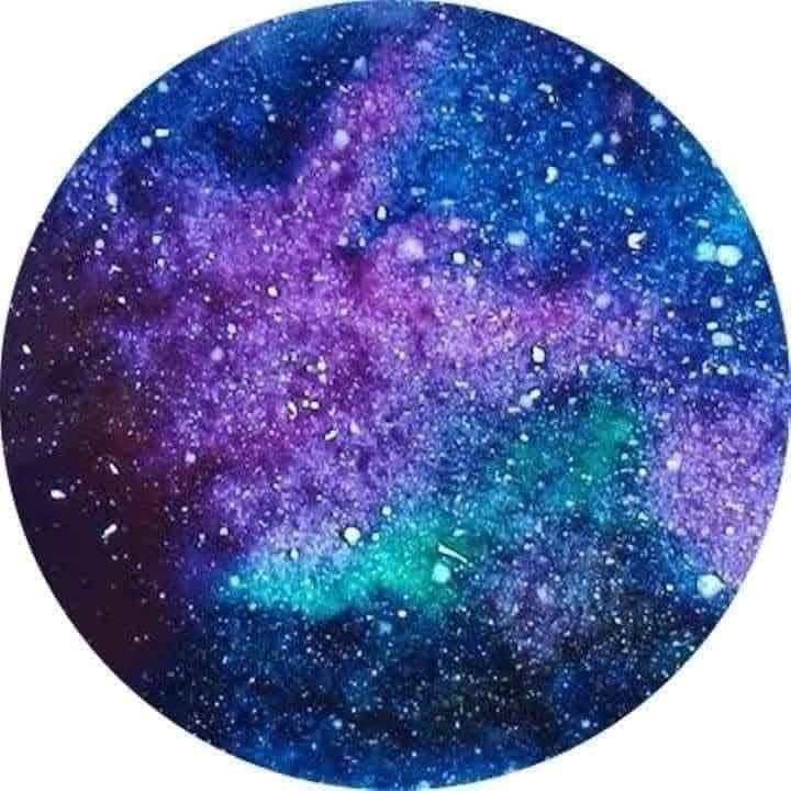 Circular design of a galaxy with blue, purple, and green colors.