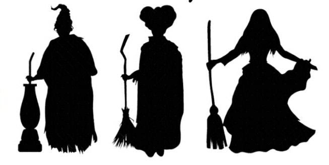 Silhouettes of three witches with brooms on a white background