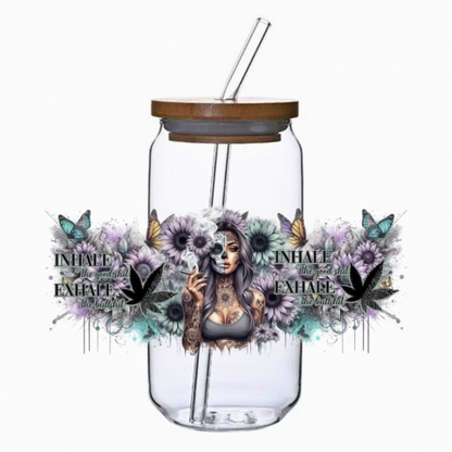 Glass jar with bamboo lid and straw, decorated with a skeleton woman, flowers, and text on a white background.