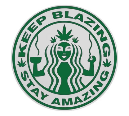 Circular coaster with a stylized figure holding a cannabis leaf and text 'Keep Blazing Stay Amazing' on a white background.