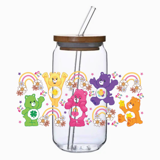 Clear tumbler with bamboo lid and straw featuring colorful cartoon bear characters and decorative elements on a white background.