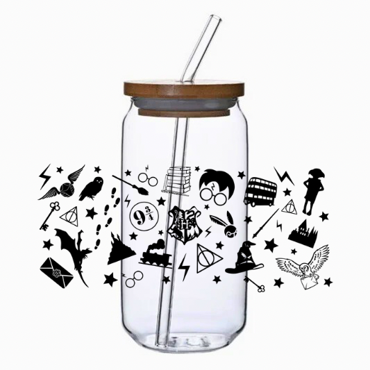Clear glass tumbler with bamboo lid and straw featuring magic-themed illustrations on a white background.