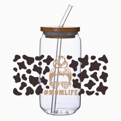 Clear glass tumbler with bamboo lid and straw, featuring a cow print and '#MOMLIFE' text.