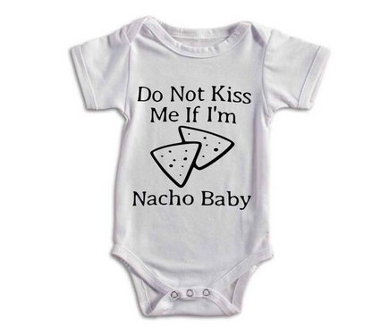White baby onesie with text 'Do Not Kiss Me If I'm Nacho Baby' on a white background