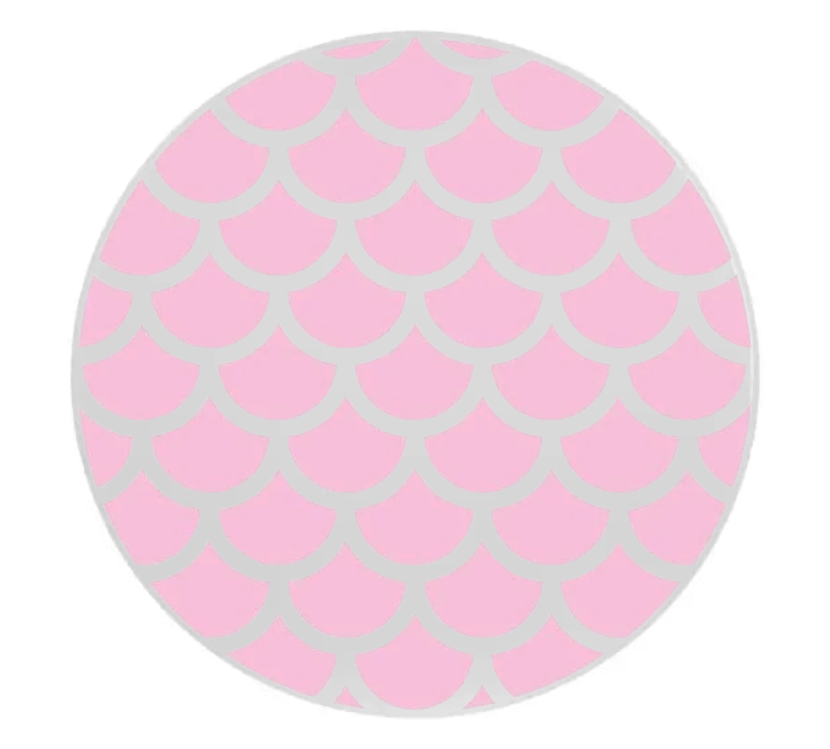 Round pink and gray mermaid patterned object on a white background