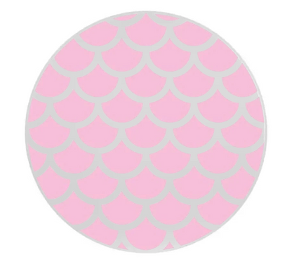 Round pink and gray mermaid patterned object on a white background