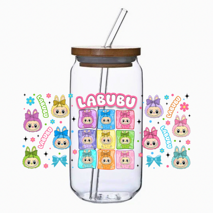 Clear tumbler with bamboo lid and straw featuring colorful monster characters design on a white background.