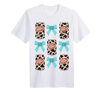 White T-shirt with Dr Pepper cow print cans with blue bows 