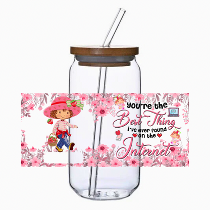 Glass tumbler with a straw, bamboo lid, and floral design with text on a white background
