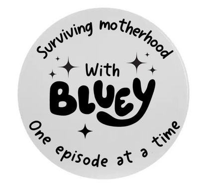 Circular sticker with text 'Surviving motherhood, One episode at a time' on a white background