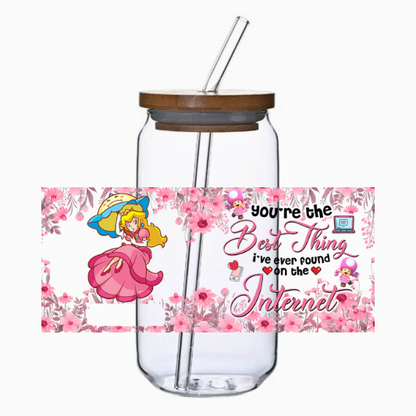 Glass tumbler with straw and bamboo lid, featuring a princess cartoon character and text on a white background