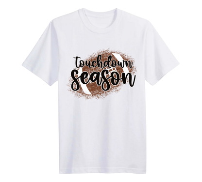White t-shirt with 'Touchdown Season' text and football graphic on a white background