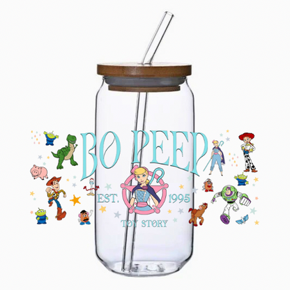 Clear tumbler with your favorite shepherdess surrounded by cartoon characters on a white background
